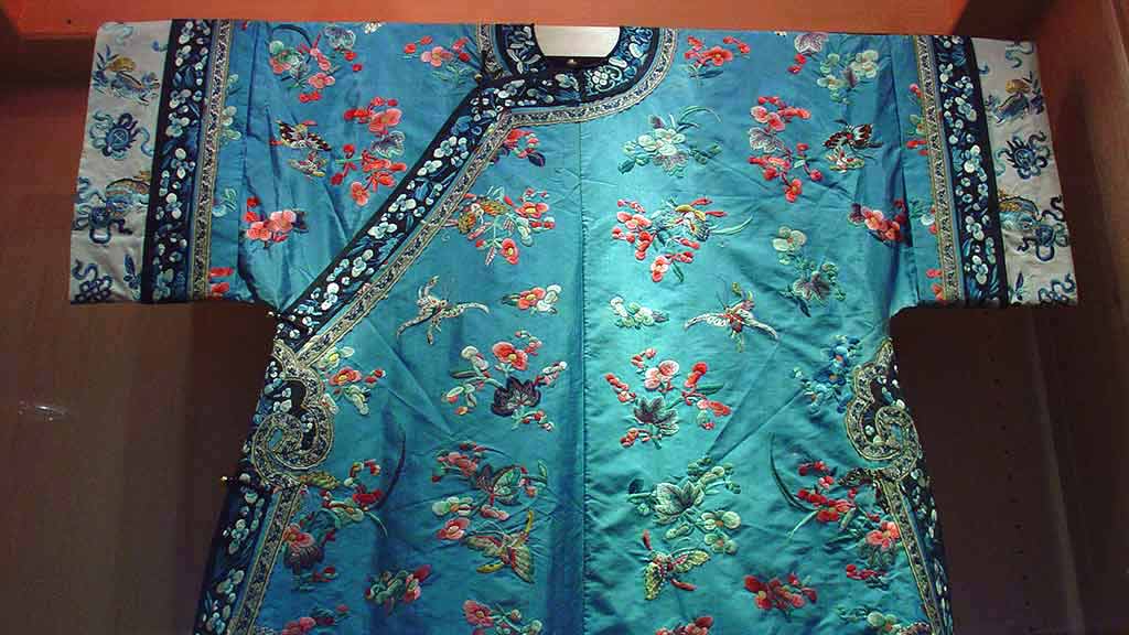 close-up of a blue embroidered silk robe