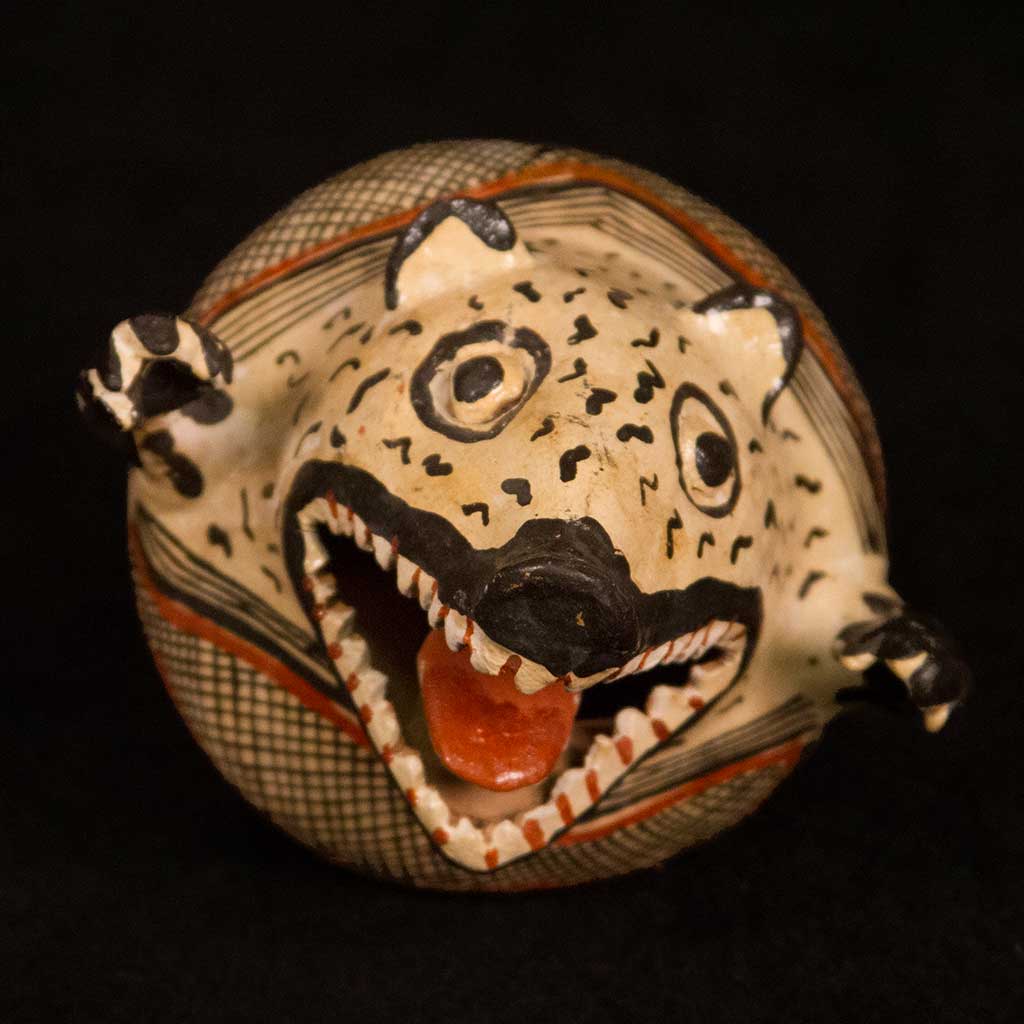 round ceramic vessel with animal head with open jaw