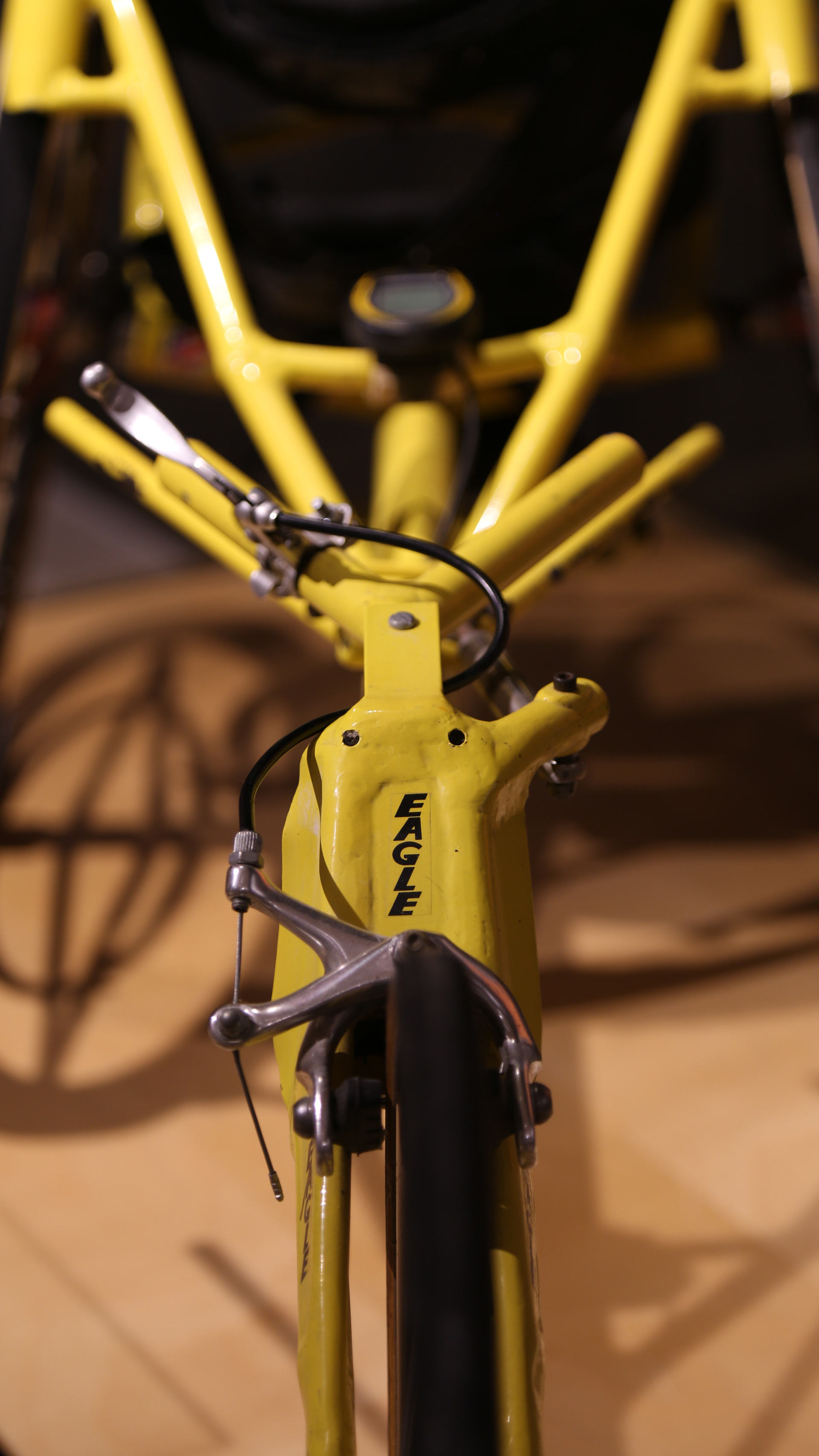 close-up of the body of a yellow bike with 'eagle' brand writing on it