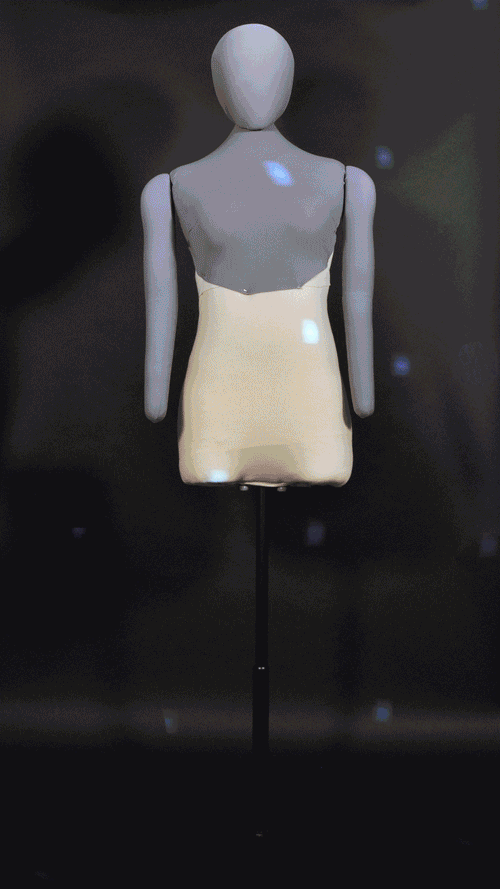 animation of a mannequin being dressed with a lace top, blue chiffon skirt, and purple hair