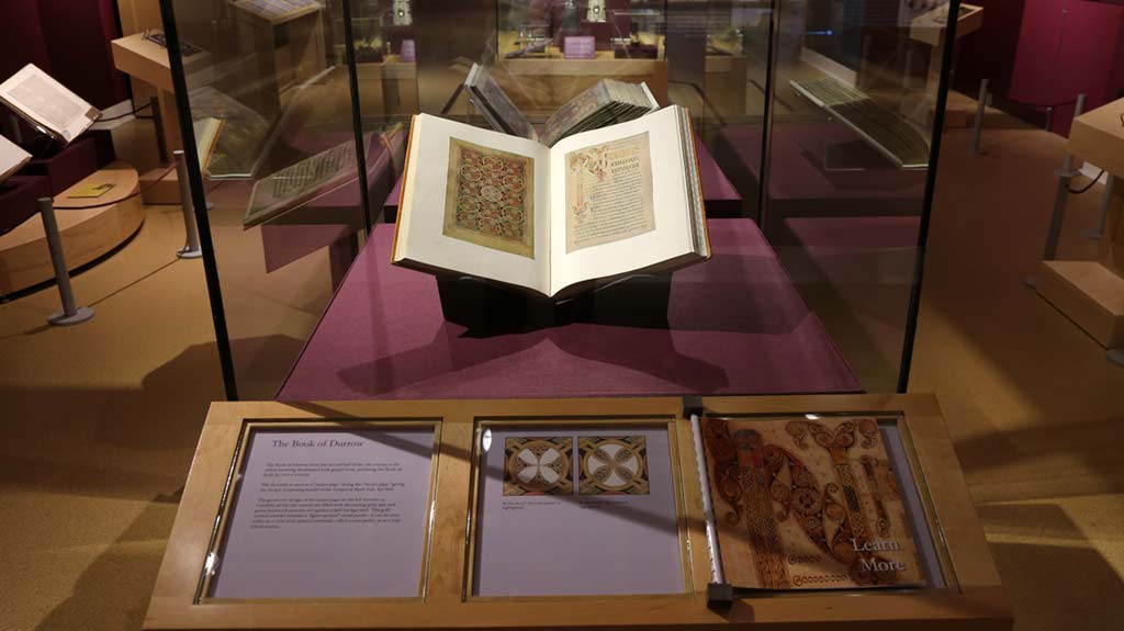 book illustrating intricate patterns in a exhibit case
