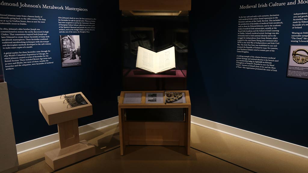a glowing book in a case in the corner with associated text under