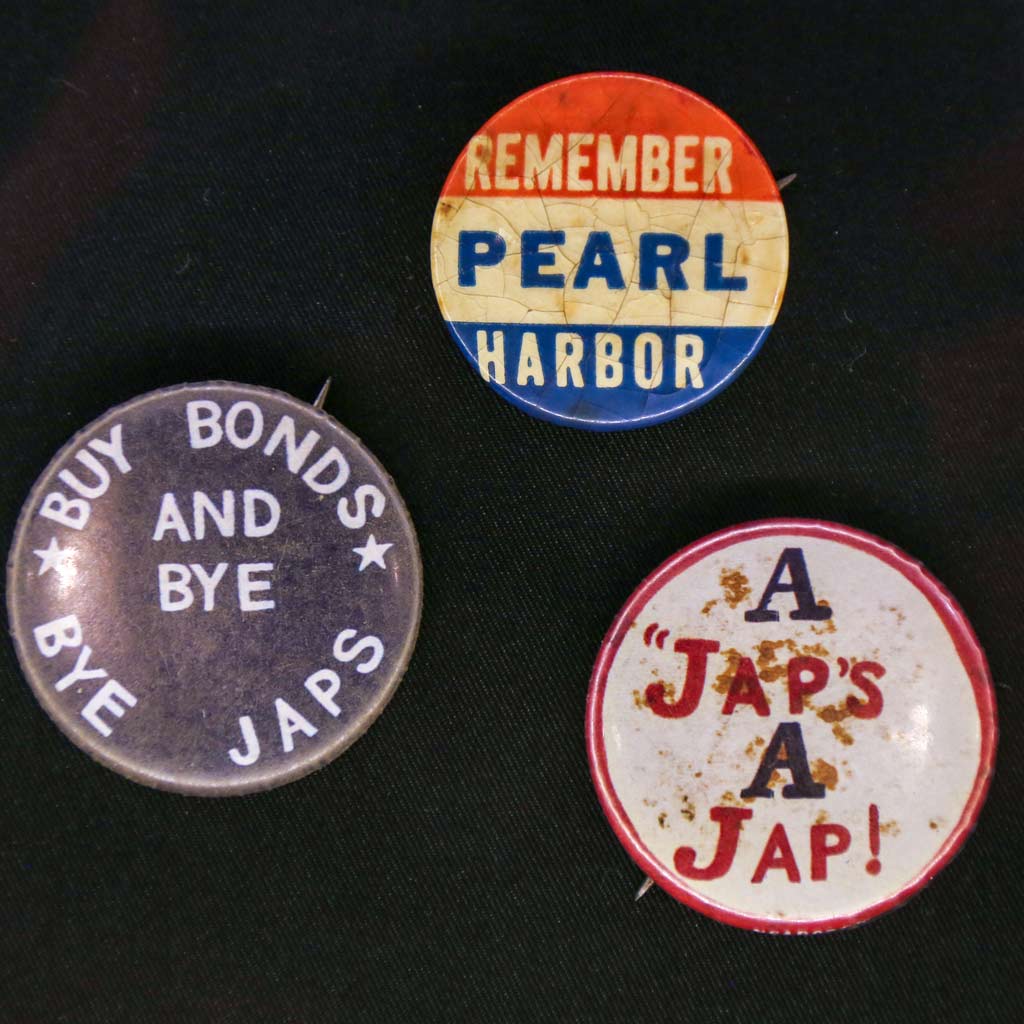 pins displaying anti-japanese and patriotic american propaganda