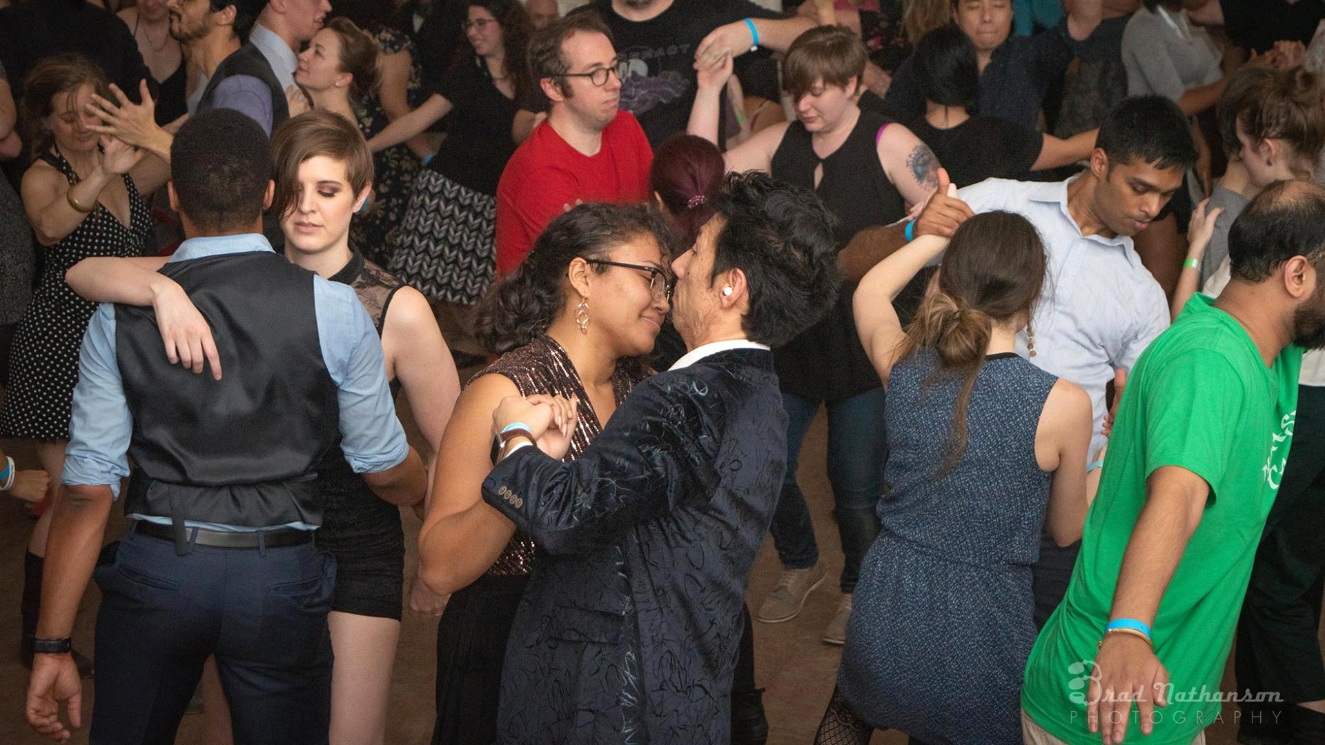 group of people dancing on a dance floor