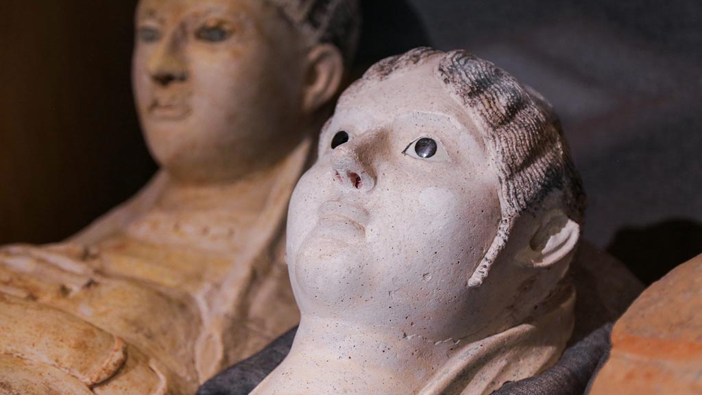 Close view of a plaster burial portrait