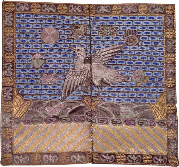 cloth square depicting a bird standing on a rock and surrounded by Buddhist symbols like the infinite knot, wheel of law, lotus