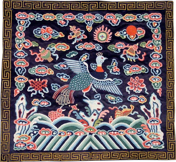 cloth square depicting a peacock surrounded by buddhist symbols such as the lotus, intriciate knot, golden fish