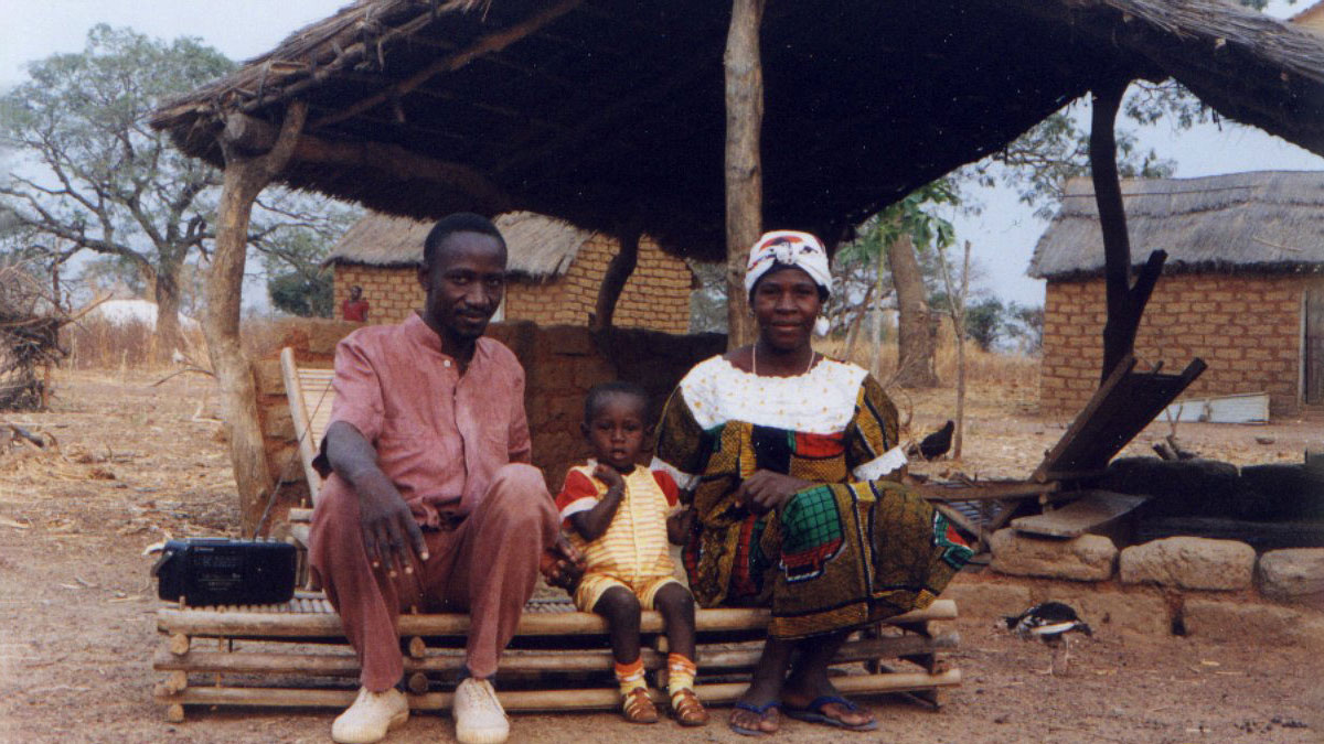 a mother, father, and their child sitting