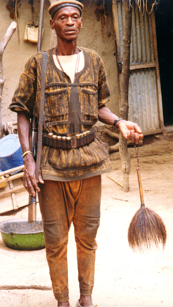 a man wearing a traditional hunter's costume