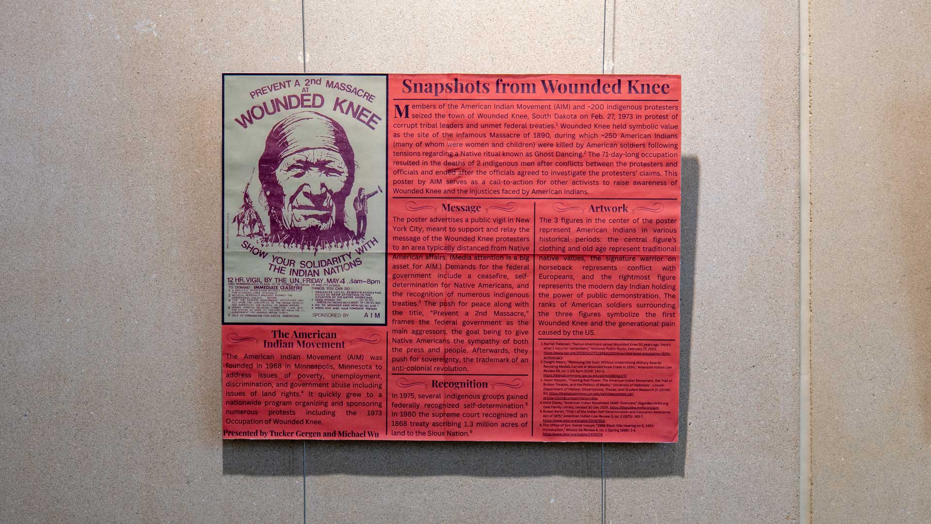 A picture of a red poster with a image of a man on it..